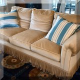 F09. Velvet sofa with fringe. 33”h x 85”w x 38”d 